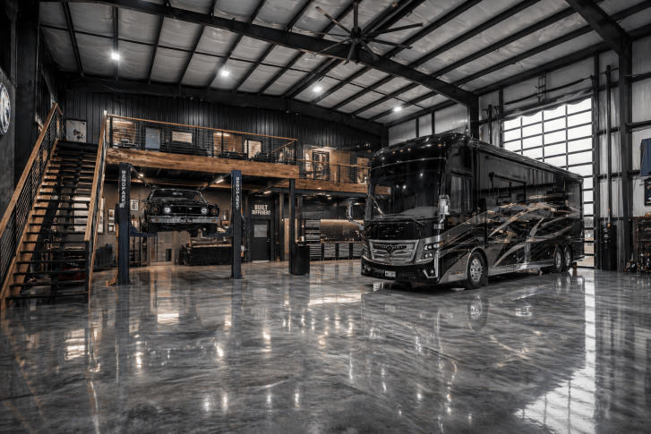 Luxury motorhome stored inside a clean indoor bay